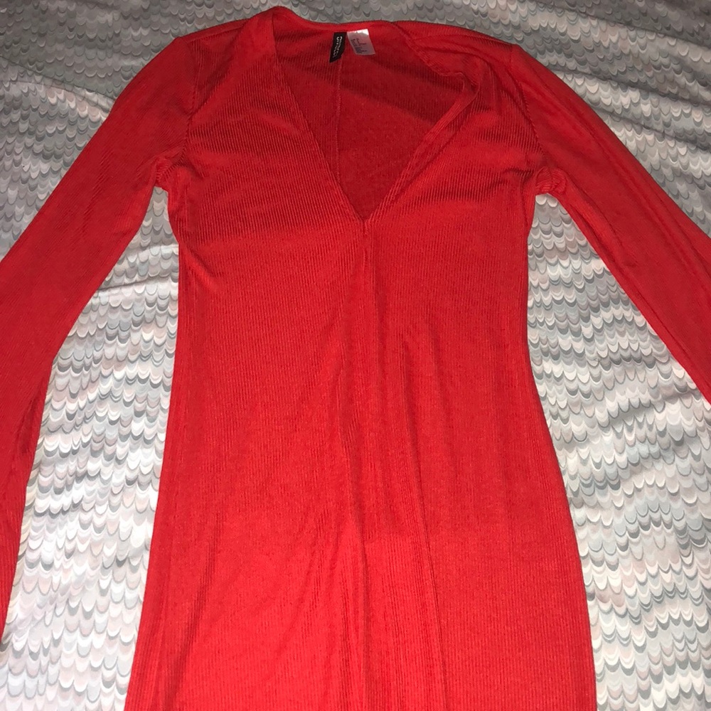 Red dress with flare out sleeves.